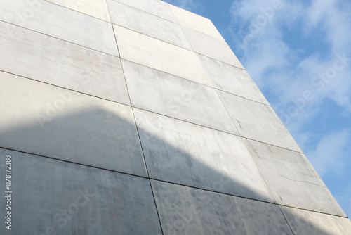 Grey stone concrete architecture wall with clear blue sky in city photo