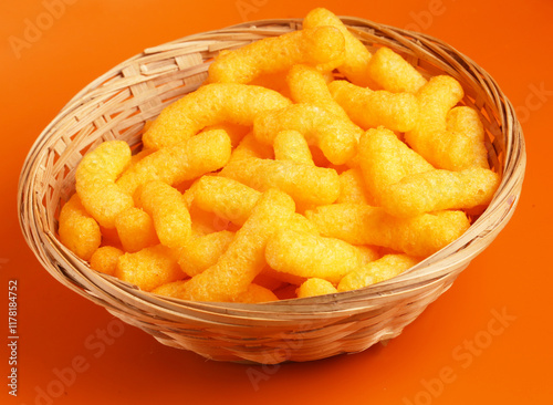 bowl of corn sticks on  lite background photo