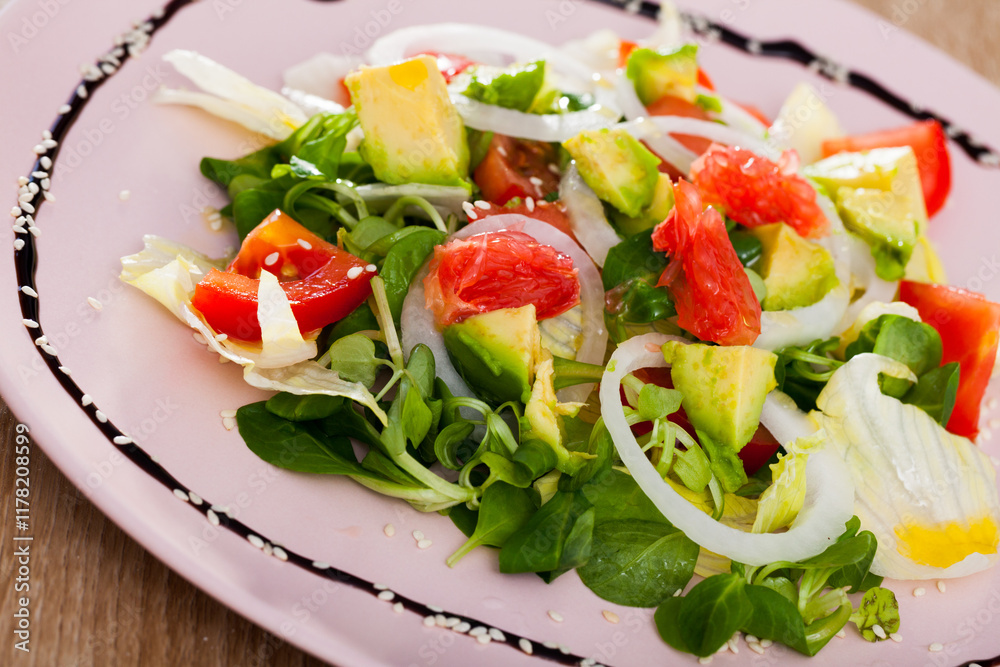 Close up of tasty salad of avocado, grapefruit, tomatoes and corn salad Close up of tasty salad of avocado, grapefruit, tomatoes and corn salad