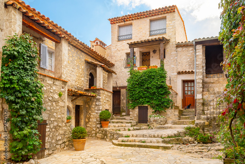Fototapeta Naklejka Na Ścianę i Meble -  A picturesque corner with traditional historic stone buildings in the hilltop town of Gourdon, France, in the Provence-Alpes-Côte d'Azur region of Southern France.