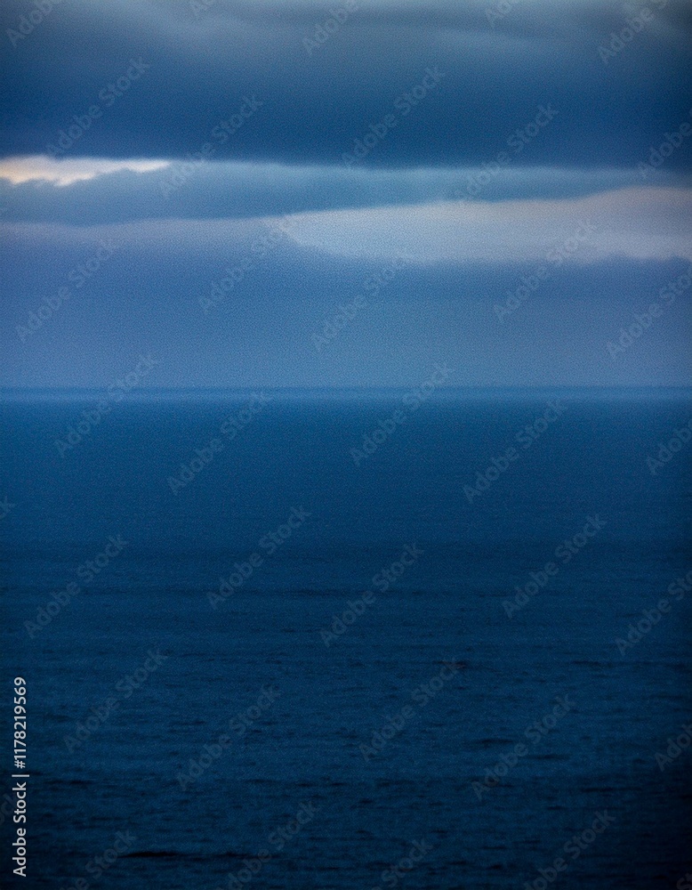 Moody seascape with dark clouds and deep blue water. Moody seascape with dark clouds and deep blue water.