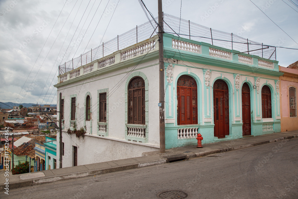 Typical tradiional ornate colonial house in a street of Santiago de Cuba Typical tradiional ornate colonial house in a street of Santiago de Cuba