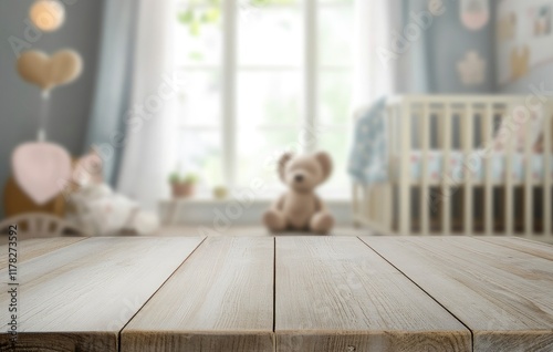 Empty wooden table top with blurred baby room interior background for product display, mock-up, and advertising concept. Stock photo with 2/3 space for text.