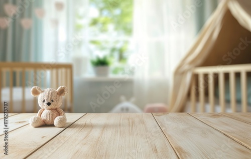 Empty wooden table top with blurred baby room interior background for product display, mock-up, and advertising concept. Stock photo with 2/3 space for text.