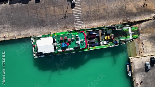 Ship is beeing loaded in Tongatapu, Nukualofa. Transportation scene, Pacific Islands - aerial photo