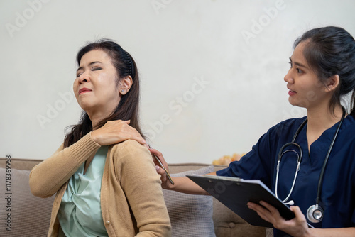 Caregiver checking symptoms of elderly patient with doctor and nurse in home environment