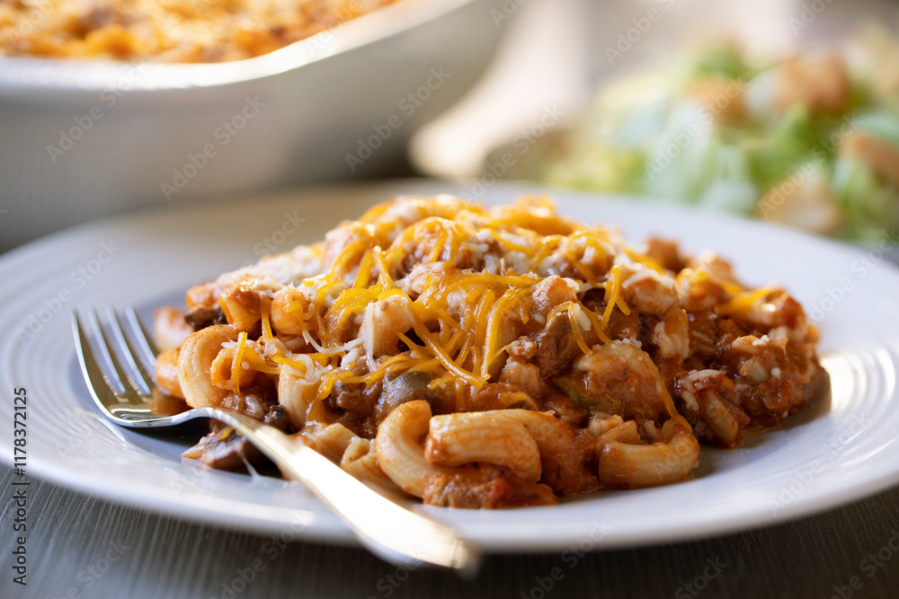 Ohio Tradition Johnny Marzetti Casserole, aka American Goulash, plated with a salad Ohio Tradition Johnny Marzetti Casserole, aka American Goulash, plated with a salad