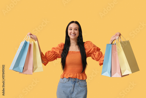 Happy young woman with shop...