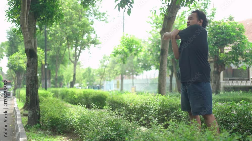 fat asian man stretching while exercising outdoor fat asian man stretching while exercising outdoor