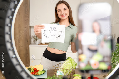 Smiling woman holding keto ...
