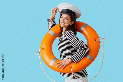 Young woman in captain cap ...