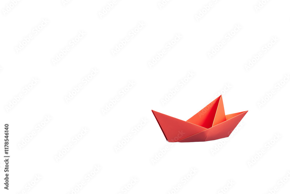 A vibrant red origami boat crafted from paper, showcasing intricate folds and a classic triangular design. A vibrant red origami boat crafted from paper, showcasing intricate folds and a classic triangular design.