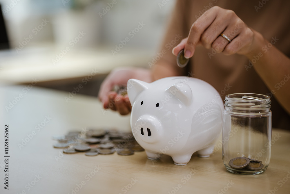 A person holds a stack of coins, which symbolizes financial success, economic planning, and future security, emphasizing the importance of building financial wealth. A person holds a stack of coins, which symbolizes financial success, economic planning, and future security, emphasizing the importance of building financial wealth.