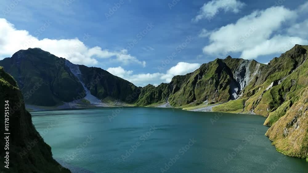 Aerial drone shot of Lake Como surrounded by majestic mountains and calm water under cloudy sky, showcasing scenic beauty in Italy. Aerial drone shot of Lake Como surrounded by majestic mountains and calm water under cloudy sky, showcasing scenic beauty in Italy.