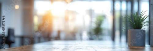 Wallpaper Mural Modern Office Interior with Blurred Background, Natural Light, and Small Green Plant in Pot Inside Contemporary Work Environment Torontodigital.ca