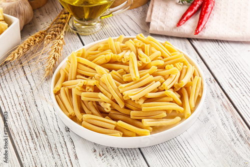 Raw dry Italian pasta - casarecce photo