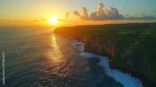 A breathtaking sunset over a coastal cliff and ocean waves.