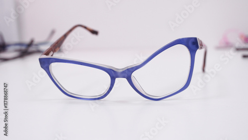 Broken eyeglasses. Assortment of broken glasses, broken hinges, missing lenses, cracked frames, deformed glasses. Mix of optical eyeglasses. Workstation for optical technician or optician 
