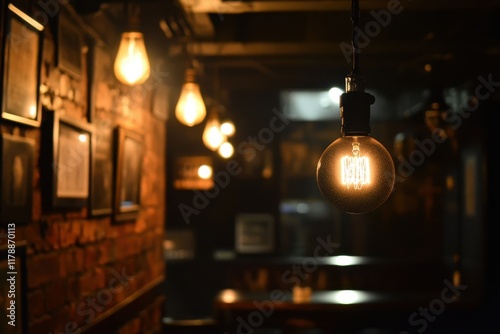 Glowing Edison bulb hangs in dimly lit brick bar