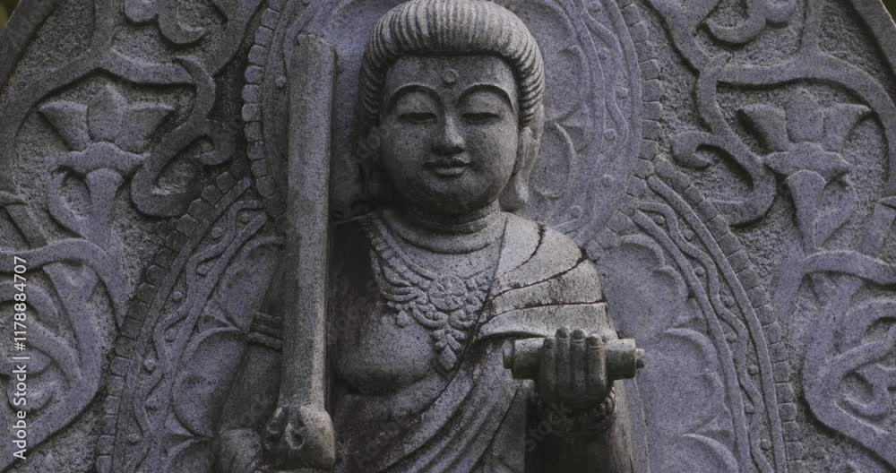 A religious stone statue of Manjusri at Japanese buddhism temple A religious stone statue of Manjusri at Japanese buddhism temple