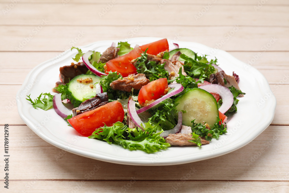 Delicious fresh tuna salad on wooden table, closeup Delicious fresh tuna salad on wooden table, closeup