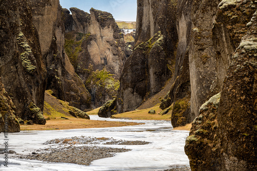 Panoramic view of Fjaðrárgljúfur or Fjadrargljufur Canyon with Fjadrar river flow on Iceland. Nature, travel, winter background, or wallpaper photo