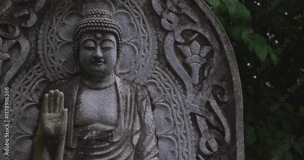 A religious stone statue of Medicine Buddha at Japanese buddhism temple A religious stone statue of Medicine Buddha at Japanese buddhism temple