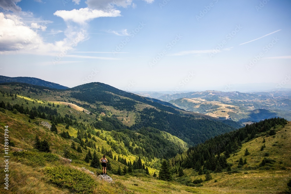 Fototapeta premium Scenic mountain landscape with hiker