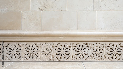 Elegant stone wall baseboard with floral carving detail