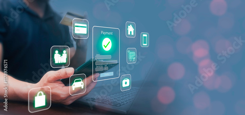 Wallpaper Mural Man using laptop and smartphone for financial transactions, Online shopping, Health, insurance, Home and car instalment to Payment via mobile banking apps. Digital banking online payments concept. Torontodigital.ca