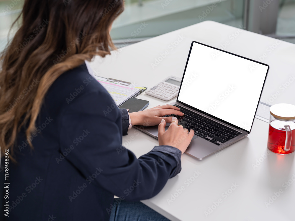 Over shoulder view laptop mock up, cropped image of young caucasian office worker business woman over shoulder view laptop mock up looking empty blank white screen, using typing notebook computer. Over shoulder view laptop mock up, cropped image of young caucasian office worker business woman over shoulder view laptop mock up looking empty blank white screen, using typing notebook computer.