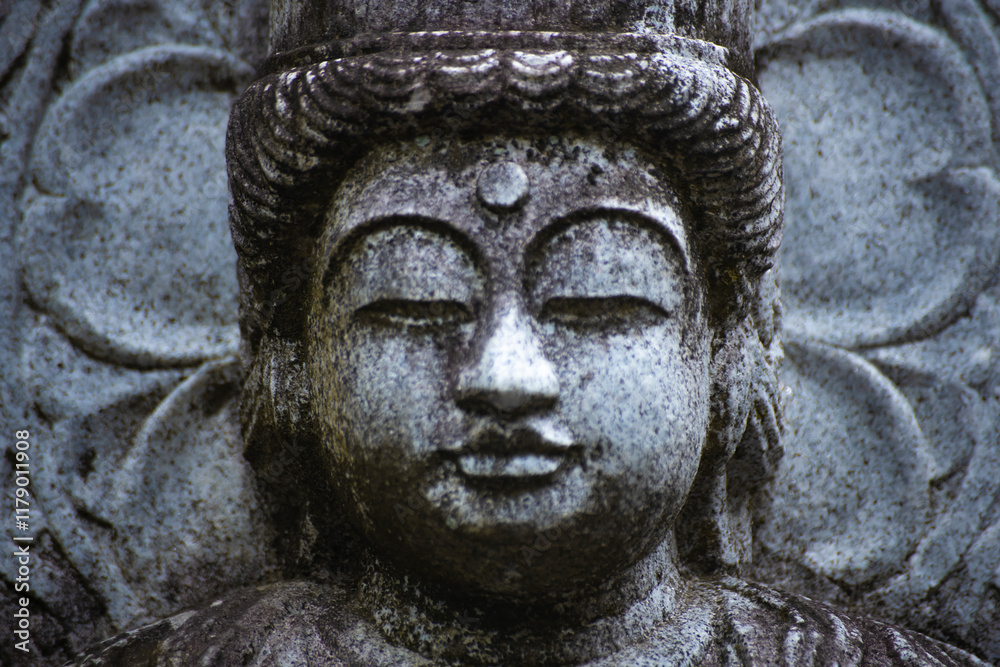 A religious stone statue of Dainichi Nyorai at Japanese buddhism temple A religious stone statue of Dainichi Nyorai at Japanese buddhism temple