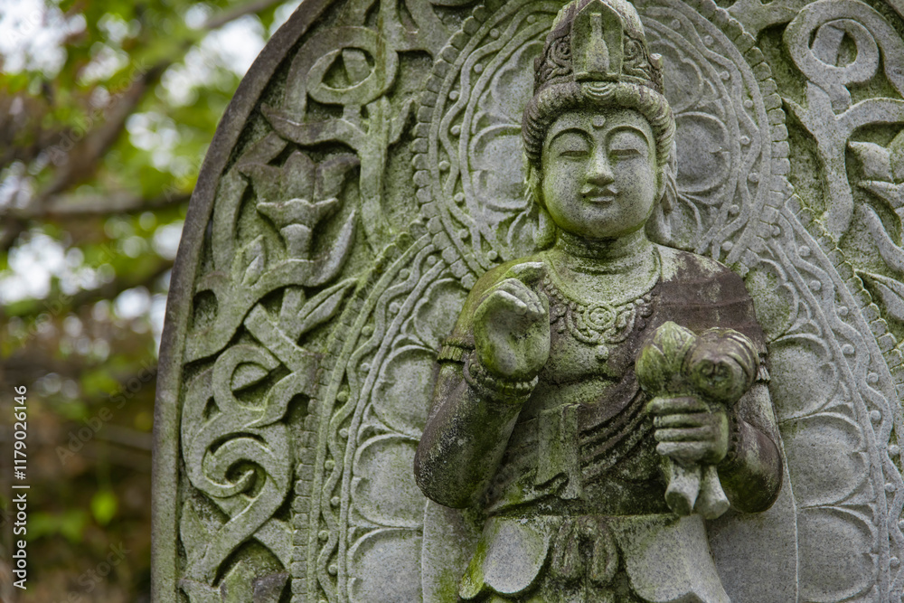 A religious stone statue of Mahasthamaprapta at Japanese buddhism temple A religious stone statue of Mahasthamaprapta at Japanese buddhism temple
