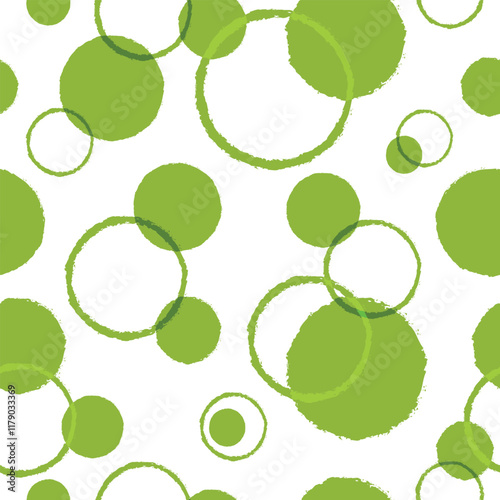 Abstract seamless pattern with hand drawn green polka dots and rings in grunge style on transparent background