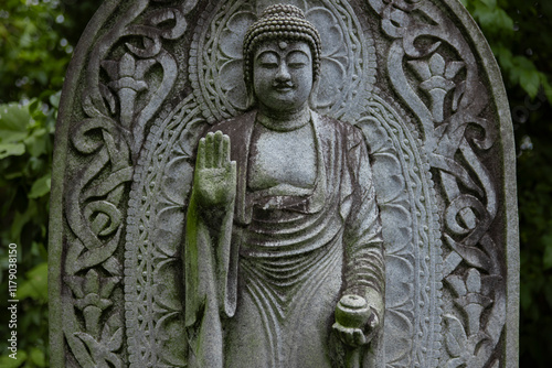 Canvas Print A religious stone statue of Medicine Buddha at Japanese buddhism temple