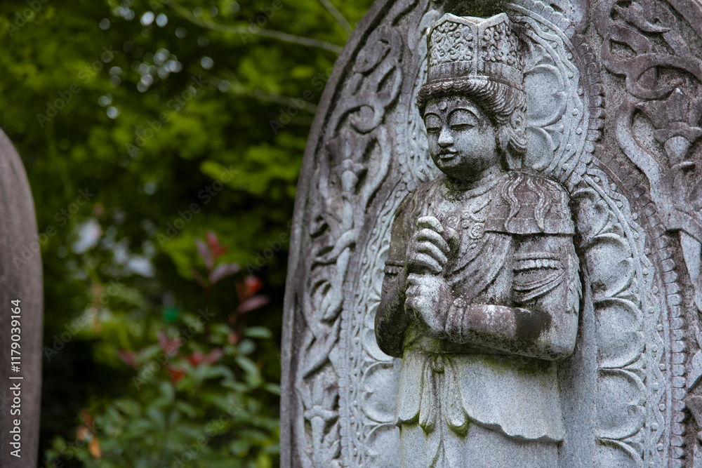 A religious stone statue of Dainichi Nyorai at Japanese buddhism temple A religious stone statue of Dainichi Nyorai at Japanese buddhism temple