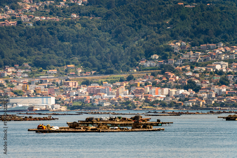 Coast of Marina in Moana with residential houses in the background - Galicia, Spain