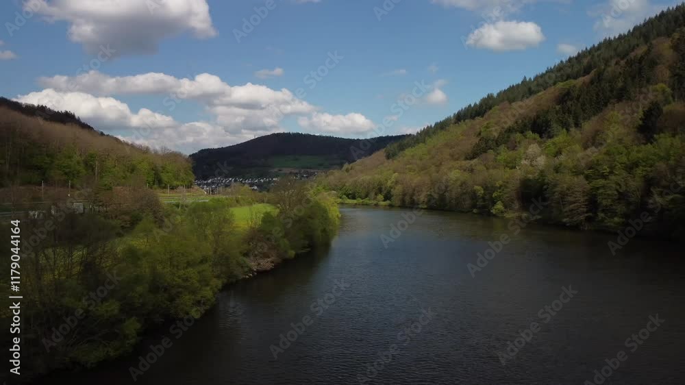 Aerial crossing river low level in spring, forest low mountains, Neckar, Germany Aerial crossing river low level in spring, forest low mountains, Neckar, Germany