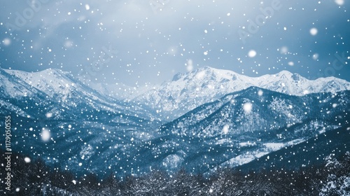 A dramatic winter landscape with towering mountains shrouded in a veil of falling snow against a darkening sky.