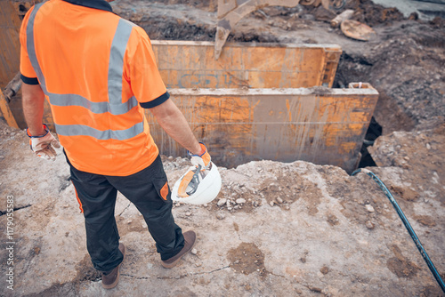 Construction worker working on a public city road reconstruction
