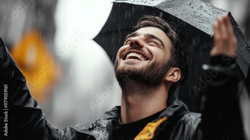 Man is smiling while holding an umbrella in the rain. Concept of happiness and contentment despite the unfavorable weather conditions