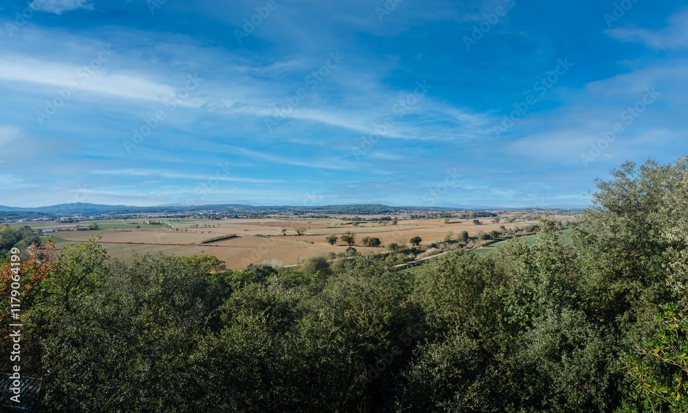 Tranquil Emporda landscape at day with rolling hills and serene fields in Baix Emporda, Catalonia. A perfect image for travel, nature, and rural tourism publications.