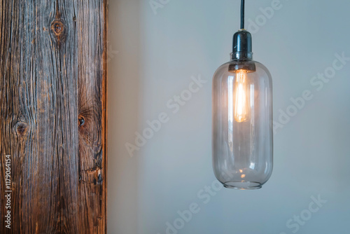 Obraz na płótnie Modern Industrial Pendant Light with Edison Bulb in Contemporary Interior Design. Minimalist Home Decor with Glass Bulb, Linen Curtains and Rustic Wood Detail w salonie