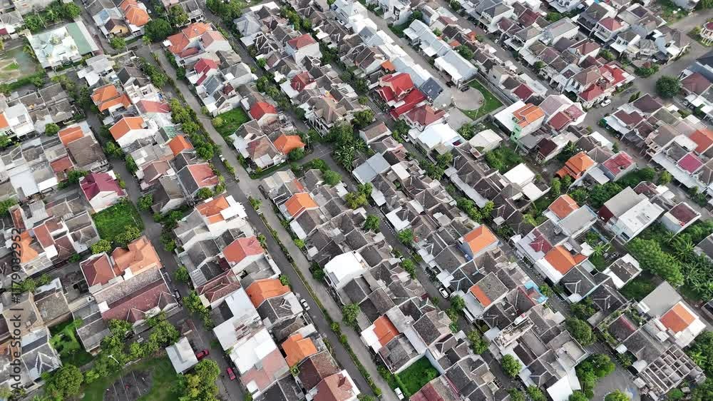residential aerial view with back alleys and rows of suburban single family homes. housing and settlement business in Indonesia. residential aerial view with back alleys and rows of suburban single family homes. housing and settlement business in Indonesia.
