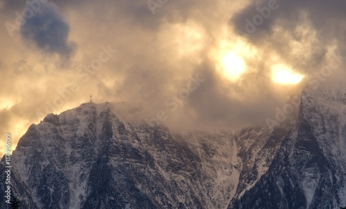 Sunset on the mountain, Caraiman Cross, Bucegi Mountains, Romania. Viewpoint from Clabucetul Taurului Peak. photo