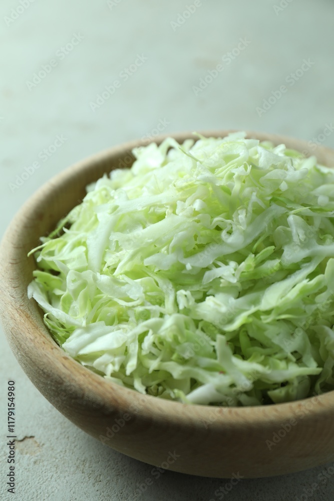 Fresh shredded cabbage on light table, closeup Fresh shredded cabbage on light table, closeup