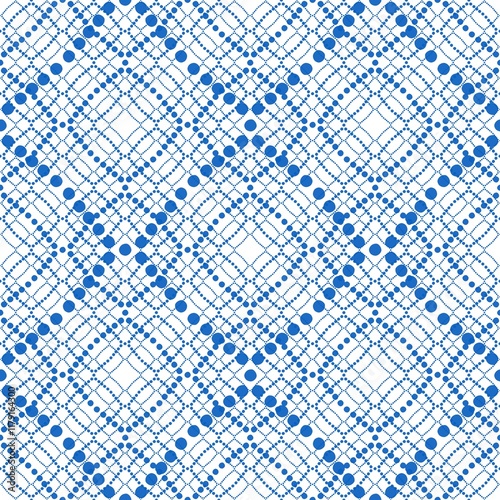 Blue and white seamless pattern featuring diamond shapes and polka dots suitable for fabric and wallpaper design