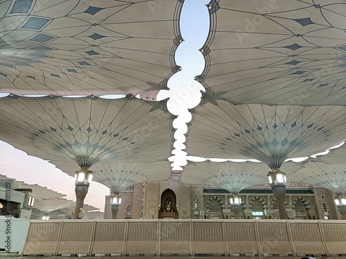 View of the courtyard of the Nabawi Mosque from under the open Nabawi mosque umbrella photo