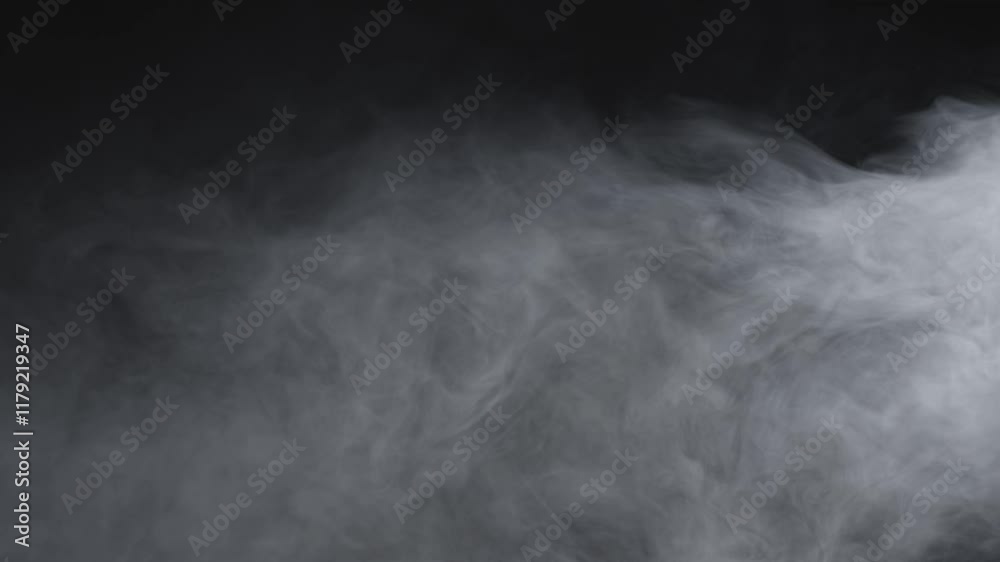 Thick white smoke slowly swirls and billows across a dark background, creating an eerie and atmospheric visual effect ideal for cinematic scenes or abstract projects