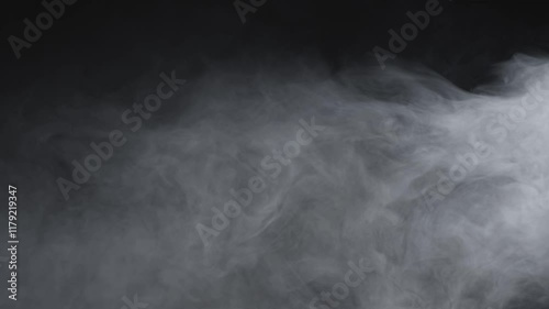 Thick white smoke slowly swirls and billows across a dark background, creating an eerie and atmospheric visual effect ideal for cinematic scenes or abstract projects